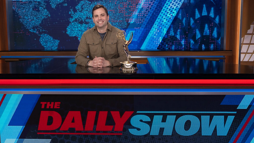 David Paul Meyer with his Emmy award on the set of The Daily Show on Comedy Central.