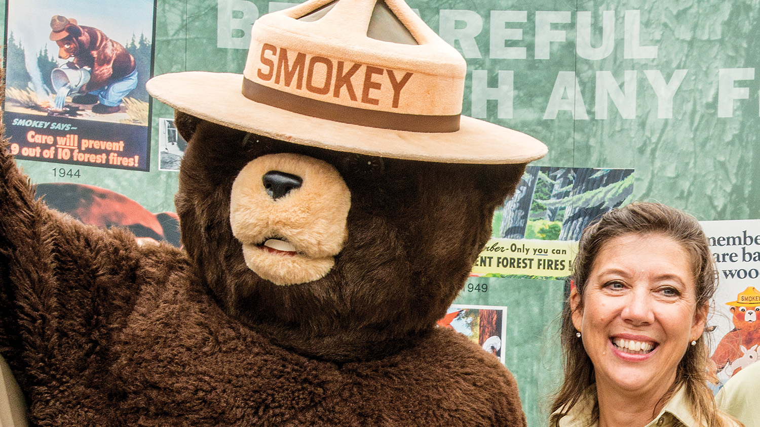 Gwen Beavans stands with Smokey Bear