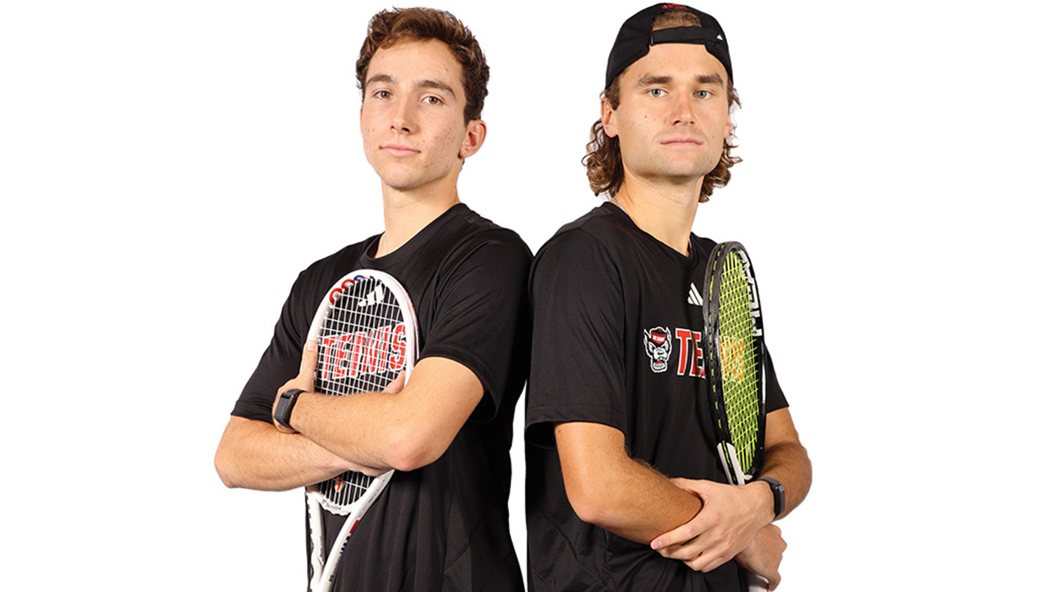 NC State tennis players Joe Wayand and Martin Borisiouk hold tennis rackets.
