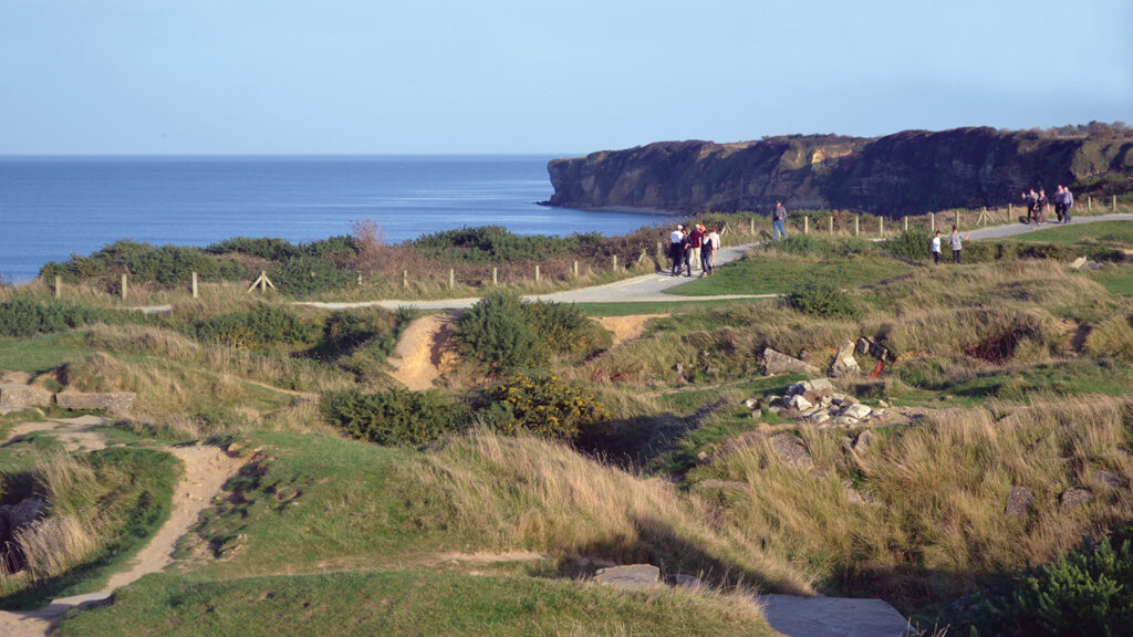 The landscape above the cliffs at Pointe du Hoc, eight miles from Omaha Beach, was forever changed by U.S. Navy bombings. Photograph by Chris Saunders.