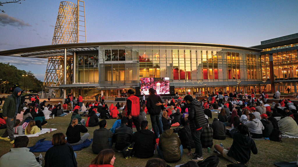 Students gather to watch a tournament game outside of Talley Student Union.