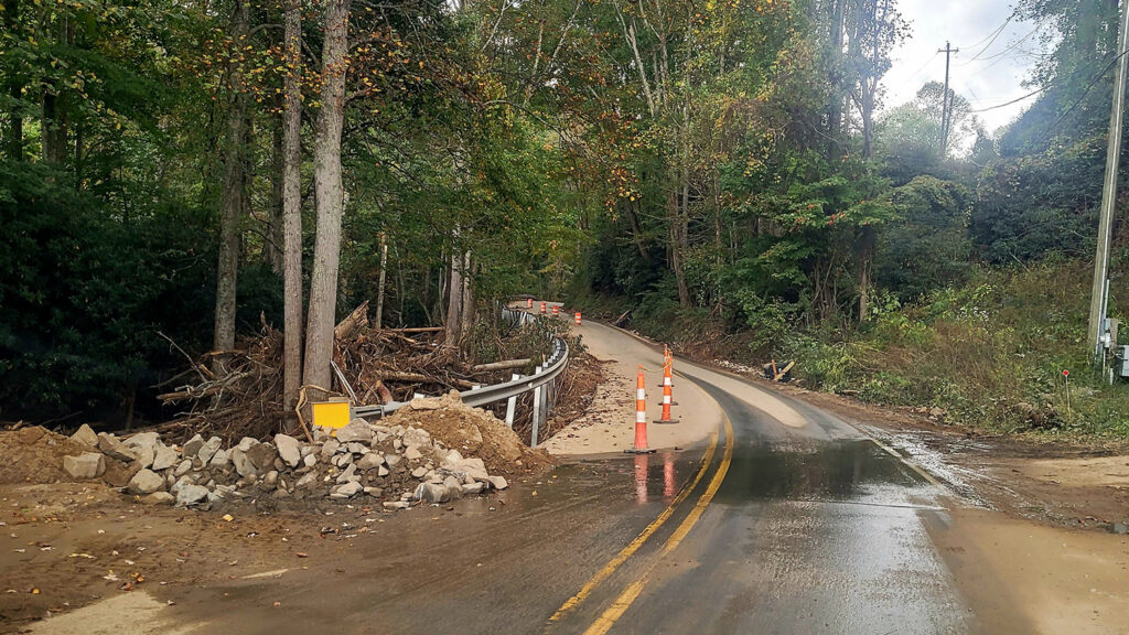 A road leading to Fairview, N.C., sees damage from Tropical Storm Helene. 