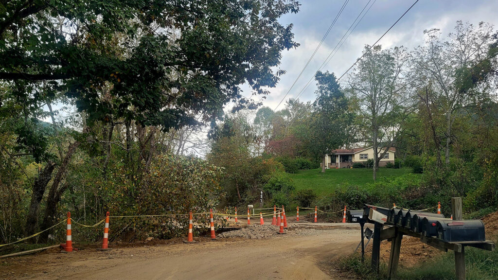 A road leading to Fairview, N.C., sees damage from Tropical Storm Helene. 