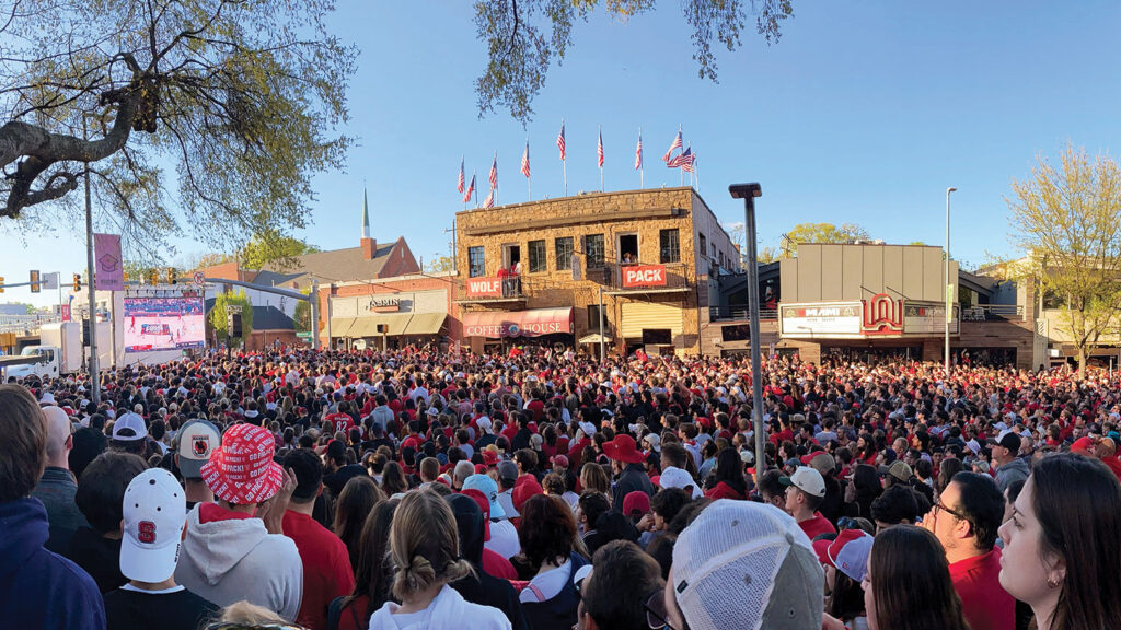 NC State basketball fans flood Hillsborough Street. 