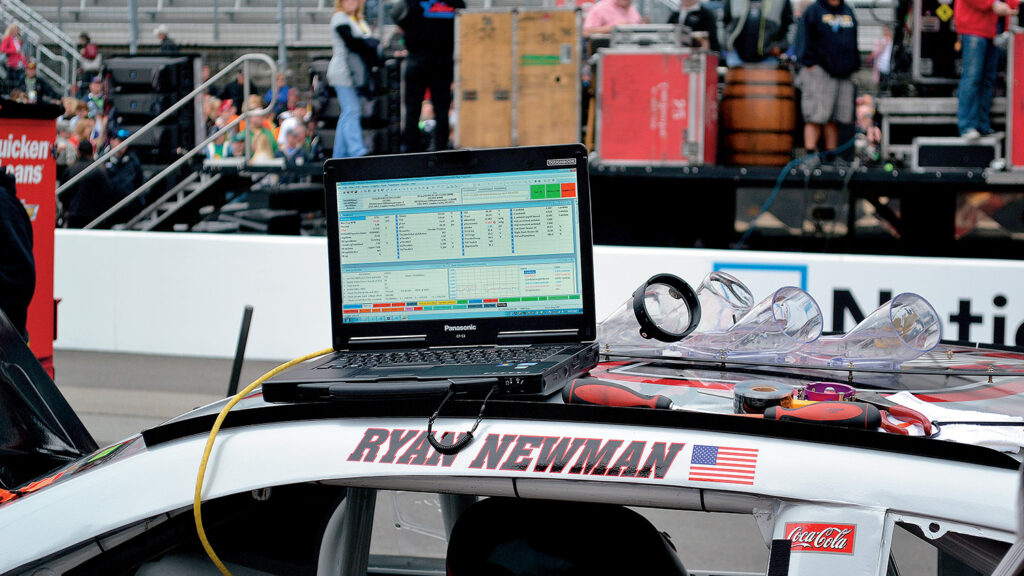 A laptop computer sits on top of NASCAR driver Ryan Newman's car before a race at Bristol Motor Speedway.