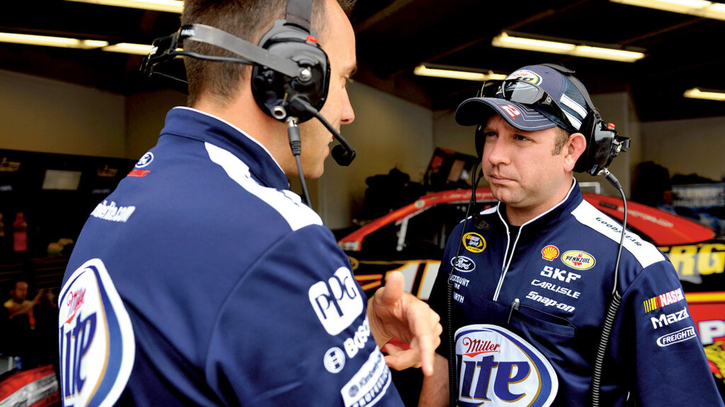 Brian Wilson says he and crew chief Paul Wolfe, left, like the #2 Miller Lite car to get off sequence from the other drivers during races and not pit exactly when others do or when it’s expected.