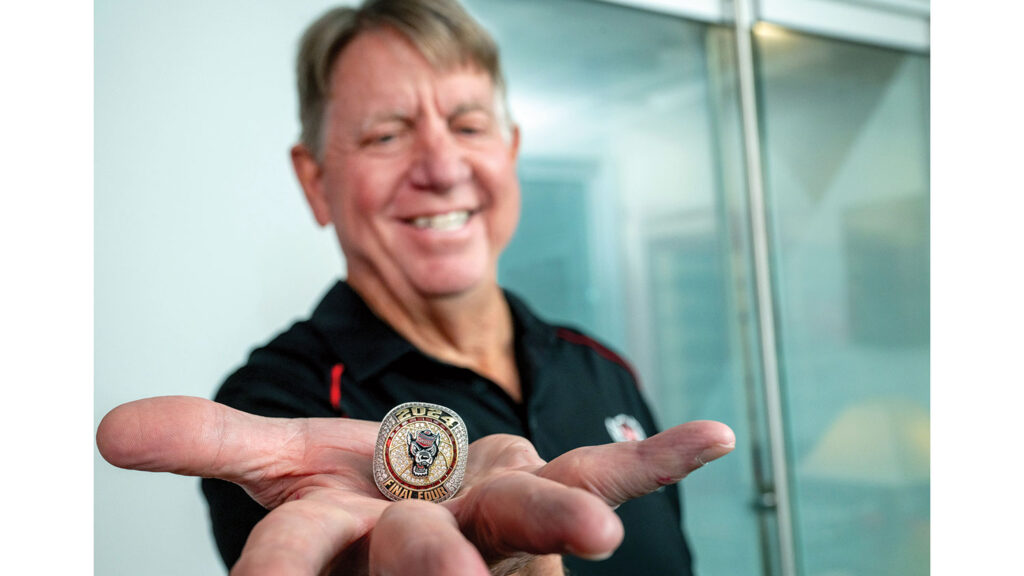 Wes Moore holds his 2024 Final Four ring.