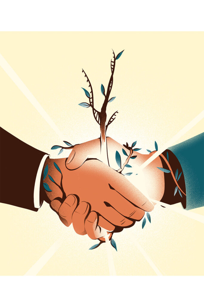 Two hands are shaking with one another while a tree and leaves sprout from the union.