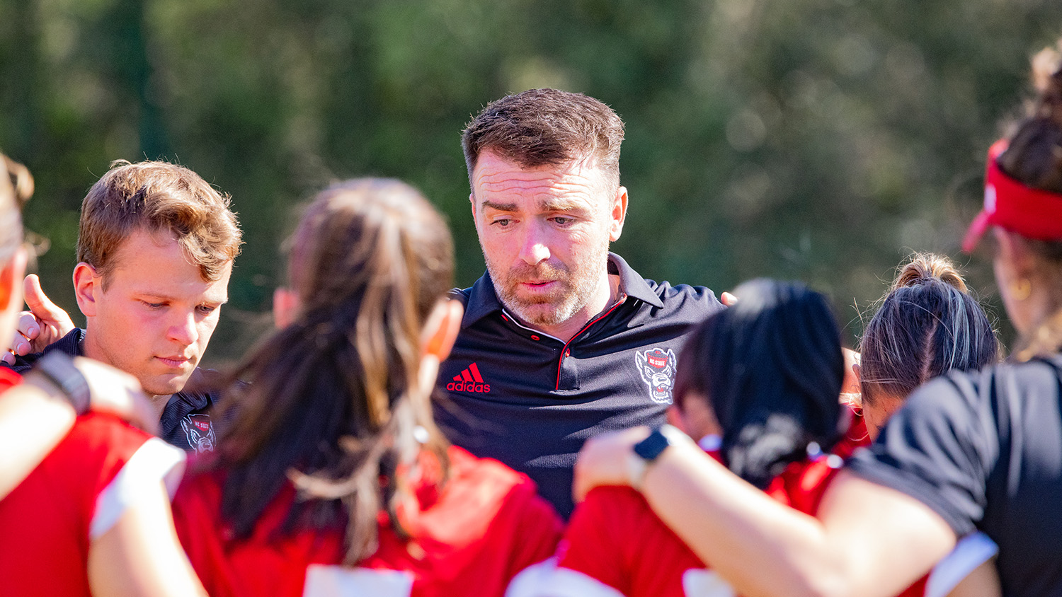 Gary Higgins coaches Wolfpack women's soccer at a workout.